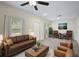 Bright living room featuring a comfortable sofa and two armchairs at 14939 Amberjack Ter # 102, Lakewood Ranch, FL 34202