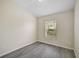 Well-lit bedroom featuring grey vinyl flooring at 14939 Amberjack Ter # 102, Lakewood Ranch, FL 34202