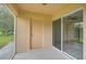 Screened patio with access to backyard and pond view at 14939 Amberjack Ter # 102, Lakewood Ranch, FL 34202
