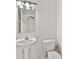 Clean bathroom with pedestal sink and toilet at 14939 Amberjack Ter # 102, Lakewood Ranch, FL 34202