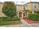 Two-story townhome with attractive landscaping and a walkway at 14939 Amberjack Ter # 102, Lakewood Ranch, FL 34202