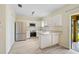 Modern kitchen with stainless steel appliances and white cabinets at 14939 Amberjack Ter # 102, Lakewood Ranch, FL 34202