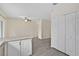 Modern kitchen features a spacious island and white cabinets at 14939 Amberjack Ter # 102, Lakewood Ranch, FL 34202