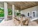 Covered patio with dining and seating areas at 2510 Gulf N Dr, Bradenton Beach, FL 34217