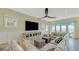 Bright living room with large sectional sofa and ocean view at 2510 Gulf N Dr, Bradenton Beach, FL 34217