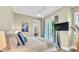 Spacious bedroom with king-size bed and private balcony at 2510 Gulf N Dr, Bradenton Beach, FL 34217