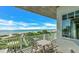 Oceanfront balcony with outdoor seating at 2510 Gulf N Dr, Bradenton Beach, FL 34217