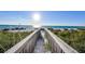 Wooden walkway leading to pristine beach at 2510 Gulf N Dr, Bradenton Beach, FL 34217