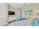 Bedroom with king bed, TV, and coastal decor at 2510 Gulf N Dr, Bradenton Beach, FL 34217