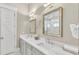Elegant bathroom with double vanity and marble countertops at 2510 Gulf N Dr, Bradenton Beach, FL 34217