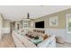 Spacious living room with a large sectional sofa and TV at 2510 Gulf N Dr, Bradenton Beach, FL 34217