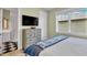 Bedroom with king-size bed, en-suite bath, and wood floors at 2510 Gulf N Dr, Bradenton Beach, FL 34217