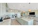 Modern kitchen with white cabinets and a large island at 2510 Gulf N Dr, Bradenton Beach, FL 34217