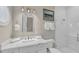 Bathroom with a walk-in shower and marble vanity at 2510 Gulf N Dr, Bradenton Beach, FL 34217