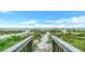 Steps to the beach from this private walkway at 2510 Gulf N Dr, Bradenton Beach, FL 34217