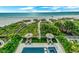 Aerial view showing pool, spa and beach access at 2510 Gulf N Dr, Bradenton Beach, FL 34217