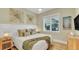Bedroom with king bed and coastal wall art at 2510 Gulf N Dr, Bradenton Beach, FL 34217