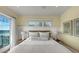 Bedroom with ocean view and wood headboard at 2510 Gulf N Dr, Bradenton Beach, FL 34217