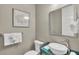 Elegant powder room with vessel sink and modern fixtures at 2510 Gulf N Dr, Bradenton Beach, FL 34217