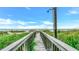 Private beach access path with outdoor shower at 2510 Gulf N Dr, Bradenton Beach, FL 34217