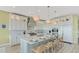 Gourmet kitchen featuring white cabinets and a center island at 2510 Gulf N Dr, Bradenton Beach, FL 34217
