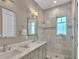 Elegant bathroom with double vanity and large shower at 2510 Gulf N Dr, Bradenton Beach, FL 34217