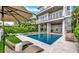 Luxury pool with lounge chairs and a modern design at 2510 Gulf N Dr, Bradenton Beach, FL 34217