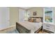 King-size bed, wood floors, and ensuite bath at 2510 Gulf N Dr, Bradenton Beach, FL 34217