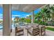 Relaxing patio with covered seating and firepit at 2510 Gulf N Dr, Bradenton Beach, FL 34217