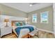 King-size bed, wood floors, and coastal decor at 2510 Gulf N Dr, Bradenton Beach, FL 34217