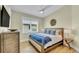 Bright bedroom with a king-size bed and wood floors at 2510 Gulf N Dr, Bradenton Beach, FL 34217