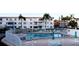 Community pool with patio furniture and fenced area at 5906 Garden Ln # A22, Bradenton, FL 34207