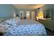 King-size bed, dresser, and ensuite bathroom in this bedroom at 5906 Garden Ln # A22, Bradenton, FL 34207