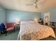 Spacious bedroom with king-size bed and an armchair at 5906 Garden Ln # A22, Bradenton, FL 34207