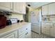 Clean and bright kitchen with white cabinets at 5906 Garden Ln # A22, Bradenton, FL 34207