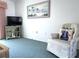 Cozy living room corner with comfortable armchair and TV at 5906 Garden Ln # A22, Bradenton, FL 34207
