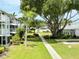 Lush landscaping, walkways, and a glimpse of a pool highlight this community view at 5906 Garden Ln # A22, Bradenton, FL 34207