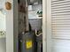 Storage closet with water heater and AC unit at 5906 Garden Ln # A22, Bradenton, FL 34207