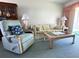 Relaxing living room featuring comfy seating and a coffee table at 5906 Garden Ln # A22, Bradenton, FL 34207