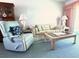 Living Room with recliner, sofa, and coffee table at 5906 Garden Ln # A22, Bradenton, FL 34207