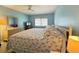 King-size bed, dresser, and TV in this relaxing bedroom at 5906 Garden Ln # A22, Bradenton, FL 34207