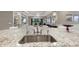 Open concept kitchen with large island and granite countertops at 12014 Perennial Pl, Lakewood Ranch, FL 34211