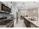 Modern kitchen features stainless steel appliances and white shaker cabinets at 12014 Perennial Pl, Lakewood Ranch, FL 34211