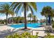 Relaxing pool with fountain and lounge chairs at 12014 Perennial Pl, Lakewood Ranch, FL 34211
