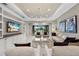Open living area with a large sectional sofa and views to the backyard at 12014 Perennial Pl, Lakewood Ranch, FL 34211