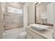 Clean bathroom with a modern vanity and shower/tub combo at 12014 Perennial Pl, Lakewood Ranch, FL 34211