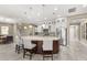 Gourmet kitchen features a large curved island, stainless steel appliances, and ample storage at 12014 Perennial Pl, Lakewood Ranch, FL 34211