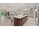 Spacious kitchen with large island, stainless steel appliances, and open floor plan at 12014 Perennial Pl, Lakewood Ranch, FL 34211