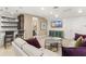 Gathering room with sectional sofa and a home bar at 12014 Perennial Pl, Lakewood Ranch, FL 34211