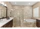 Luxurious bathroom with a soaking tub, walk-in shower, and dual vanities at 12014 Perennial Pl, Lakewood Ranch, FL 34211